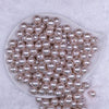 Top view of a pile of 12mm Ivory with Glitter Faux Pearl Acrylic Bubblegum Beads - 20 Count