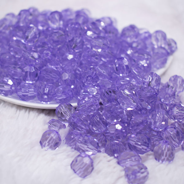 front view of a pile of 12mm Purple Transparent Faceted Shaped Bubblegum Beads
