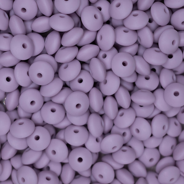 top view of a pile of 12mm Lilac Purple Lentil Silicone Bead