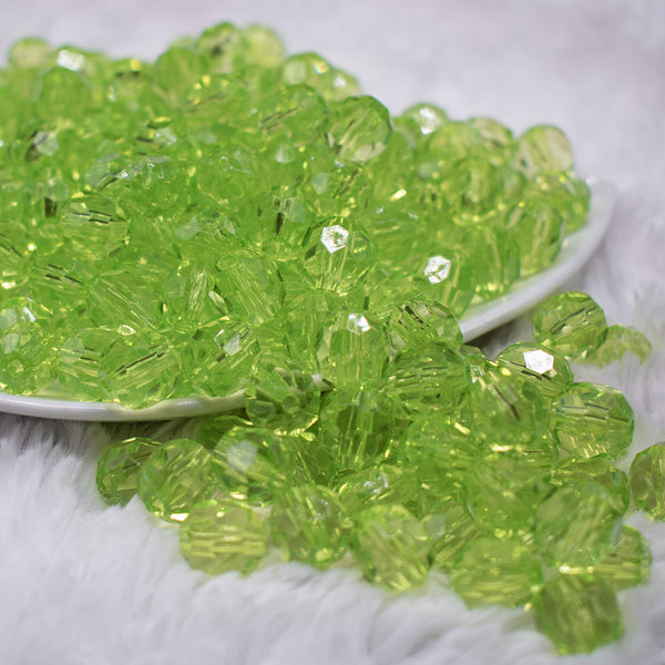 front view of a pile of 12mm Lime Green Transparent Faceted Shaped Bubblegum Beads