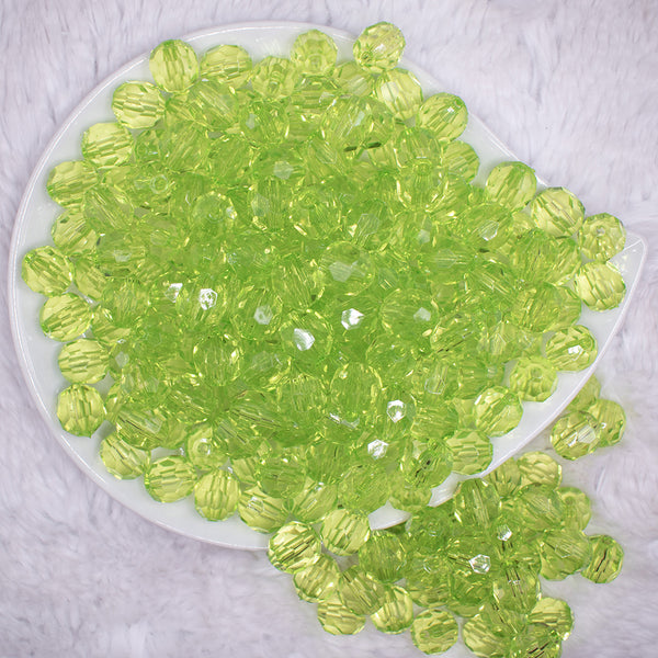 top view of a pile of 12mm Lime Green Transparent Faceted Shaped Bubblegum Beads