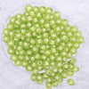 top view of a pile of 12mm Lime Green Transparent Pumpkin Shaped Bubblegum Beads