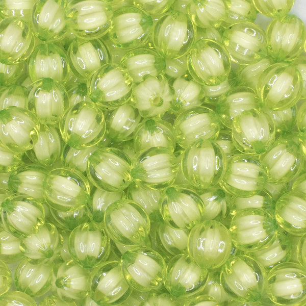 close up view of a pile of 12mm Lime Green Transparent Pumpkin Shaped Bubblegum Beads