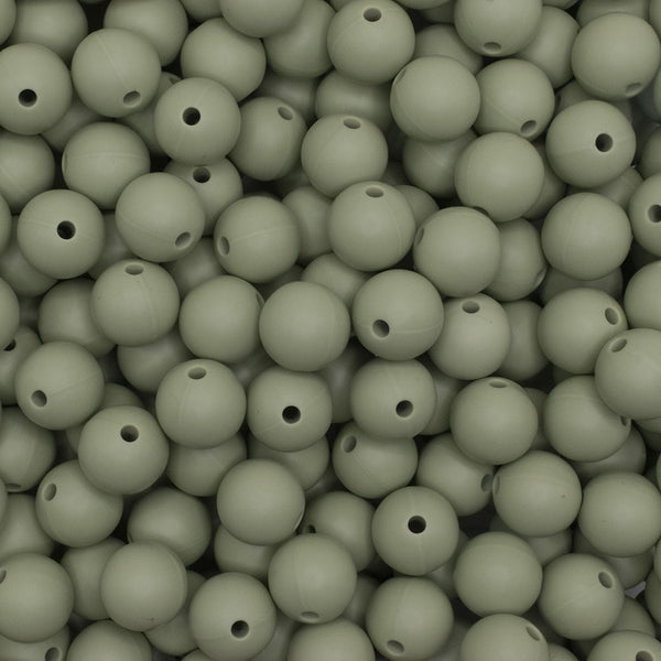 close up view of a pile of 12mm Matcha Green Round Silicone Bead