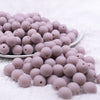 Front view of a pile of 12mm Mauve Pink Matte Acrylic Bubblegum Beads