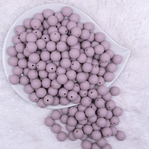 Top view of a pile of 12mm Mauve Pink Matte Acrylic Bubblegum Beads