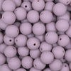 Close up view of a pile of 12mm Mauve Pink Matte Acrylic Bubblegum Beads