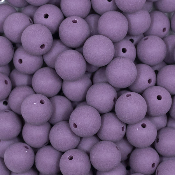 Close up view of a pile of 12mm Purple Matte Acrylic Bubblegum Beads