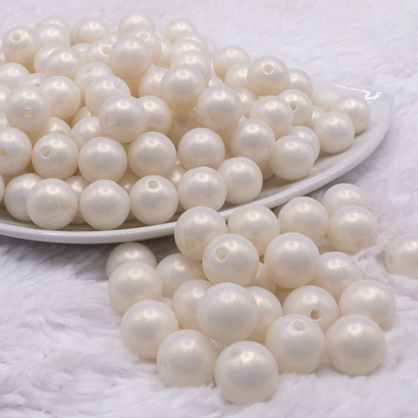 front view of a pile of 12mm Matte Ivory pearl Acrylic Bubblegum Beads