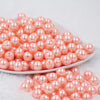 front view of a pile of 12mm Melon Orange Pearl Acrylic Bubblegum Beads [20 Count]