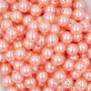 close up view of a pile of 12mm Melon Orange Pearl Acrylic Bubblegum Beads [20 Count]