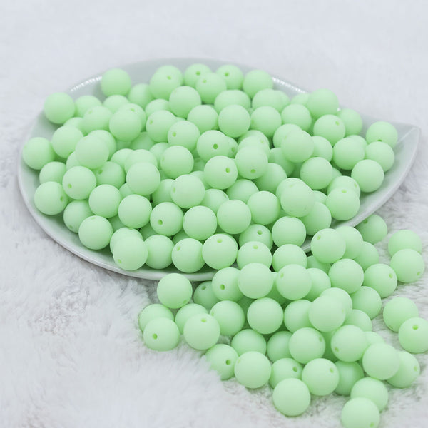 Front view of a pile of 12mm Mint Green Matte Acrylic Bubblegum Beads