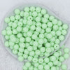 Top view of a pile of 12mm Mint Green Matte Acrylic Bubblegum Beads
