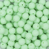 Close up view of a pile of 12mm Mint Green Matte Acrylic Bubblegum Beads
