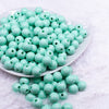 Front view of a pile of 12mm Pastel Mint Green Plaid Print Chunky Acrylic Bubblegum Beads - 20 Count