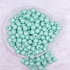 Top view of a pile of 12mm Pastel Mint Green Plaid Print Chunky Acrylic Bubblegum Beads - 20 Count
