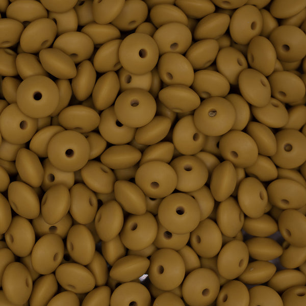 top view of a pile of 12mm Mustard Yellow Lentil Silicone Bead