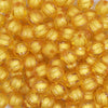close up view of a pile of 12mm Mustard Yellow Transparent Pumpkin Shaped Bubblegum Beads