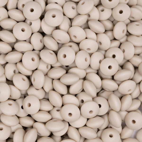 top view of a  pile of 12mm Navajo White Lentil Silicone Bead