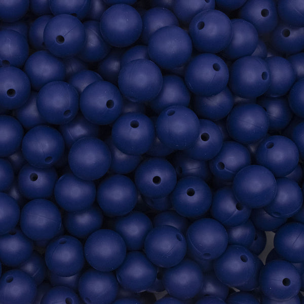 close up view of a pile of 12mm Navy Blue Round Silicone Bead
