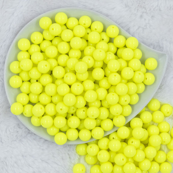 Top view of a pile of 12mm Neon Yellow Solid Acrylic Bubblegum Beads [20 & 50 Count]