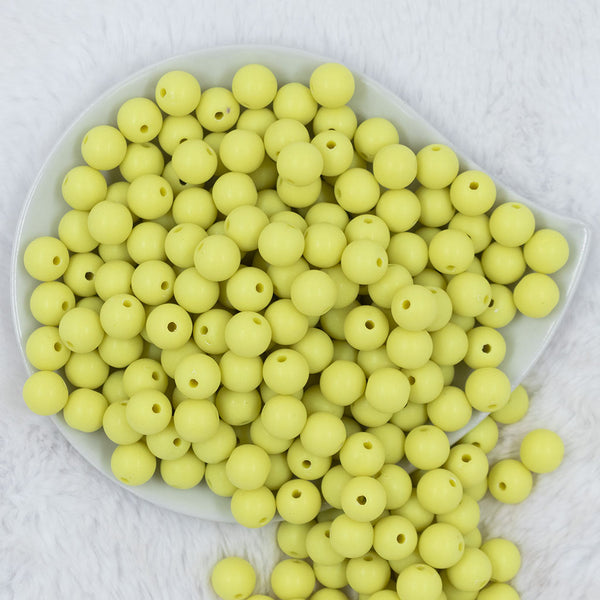 Top view of a pile of 12mm Bright Yellow Matte Acrylic Bubblegum Beads
