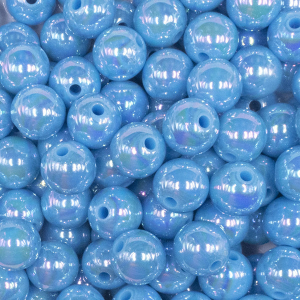 close up view of a pile of 12mm Ocean Blue AB Solid Acrylic Bubblegum Beads