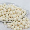 Front view of a pile of 12mm Off White Matte Acrylic Bubblegum Beads