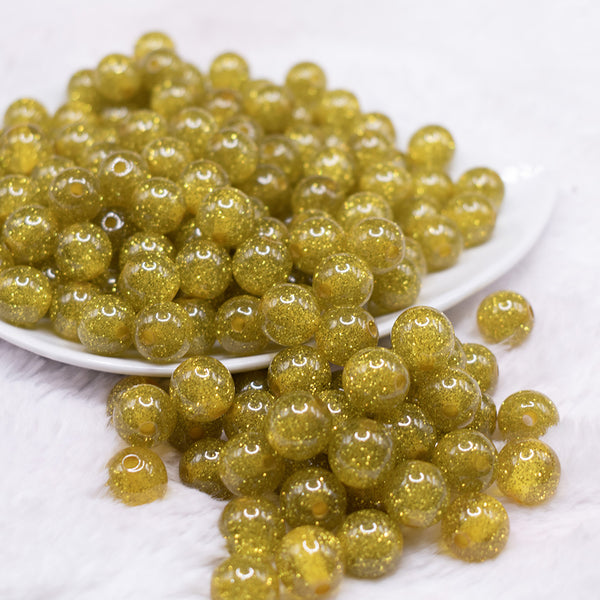 front view of a pile of 12mm Olive Yellow Shimmer Glitter Sparkle Bubblegum Beads - 20 Count