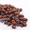 front view of a pile of 12mm Orange with Black Stripe Beach Ball Bubblegum Beads - 20 count