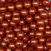 Close up view of a pile of 12mm Orange with Glitter Faux Pearl Acrylic Bubblegum Beads - 20 Count