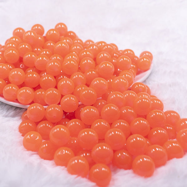Front view of a pile of 12mm Orange Glow in the Dark Bubblegum Beads [20 & 50 Count]