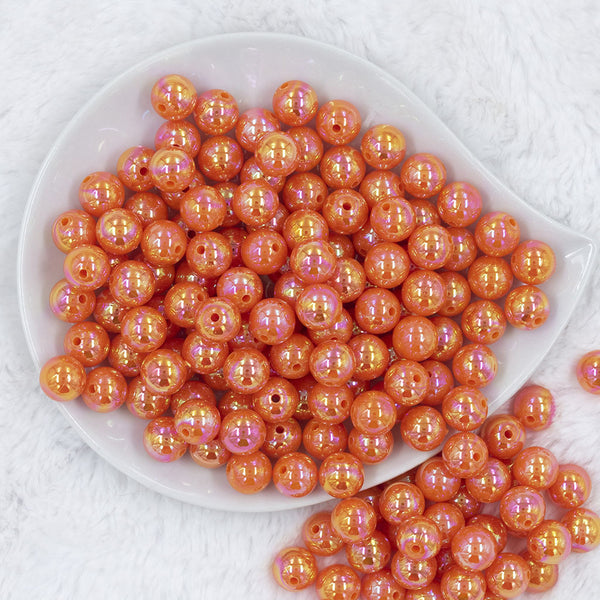 Top view of a pile of 12mm Orange Iridescent AB Solid Acrylic Bubblegum Beads [20 Count]