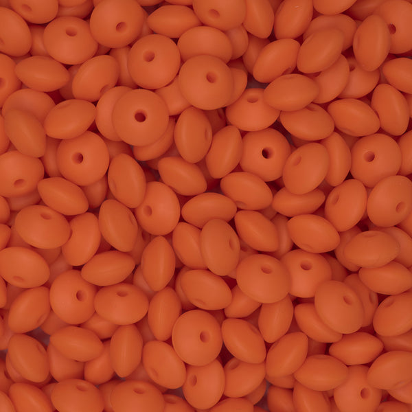 top view of a pile of 12mm Orange Lentil Silicone Bead