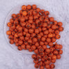 top view of a pile of 12mm Jack O Lantern Pumpkin Face Halloween print Bubblegum Beads