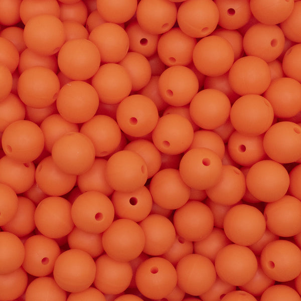 close up view of a pile of 12mm Orange Round Silicone Bead