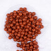 Top view of a pile of 12mm Orange & Black Tiger Print Chunky Acrylic Bubblegum Beads - 20 Count
