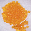 top view of a pile of 12mm Orange Transparent Faceted Shaped Bubblegum Beads
