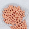 Top view of a pile of 12mm Peach Matte Acrylic Bubblegum Beads