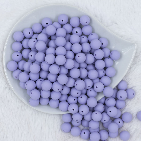 Top view of a pile of 12mm Periwinkle Purple Matte Acrylic Bubblegum Beads