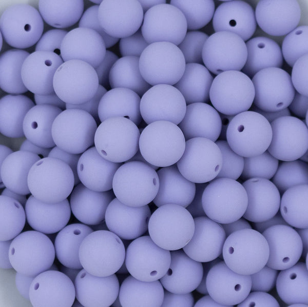Close up view of a pile of 12mm Periwinkle Purple Matte Acrylic Bubblegum Beads