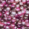 close up view of a pile of 12mm Pink and Brown Ombre Shimmer Faux Pearl Bubblegum Beads