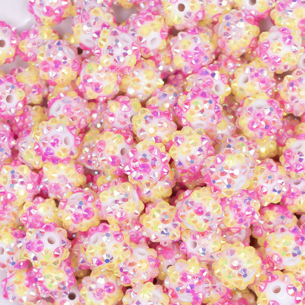 close up view of a pile of 12mm Pink and Yellow Confetti Rhinestone AB Bubblegum Beads -10 & 20 Count