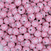 close up view of a pile of 12mm Pink & White Cow Print Chunky Acrylic Bubblegum Beads - 20 Count
