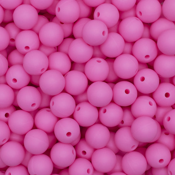 Close up view of a pile of 12mm Pink Round Silicone Bead