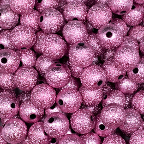 Close up view of a pile of 12mm Pink Stardust Bubblegum Beads [20 Count]