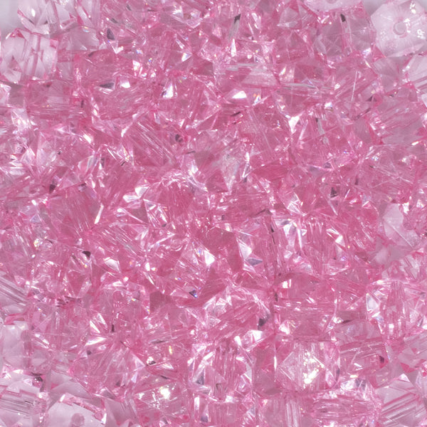 close up view of a pile of 12mm Pink Transparent Cube Faceted Bubblegum Beads