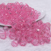 front view of a pile of 12mm Pink Transparent Faceted Shaped Bubblegum Beads