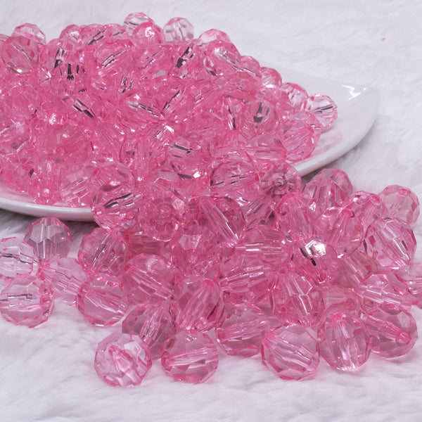 front view of a pile of 12mm Pink Transparent Faceted Shaped Bubblegum Beads