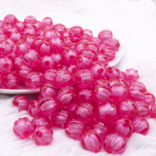 front view of a pile of 12mm Pink Transparent Pumpkin Shaped Bubblegum Beads